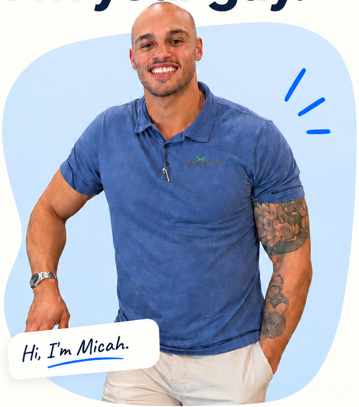 Micah smiling in his blue shirt, ready to welcome you at Mistlin Honda